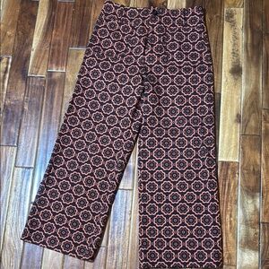 Anthropologie Black and Orange Patterned Flare Pants